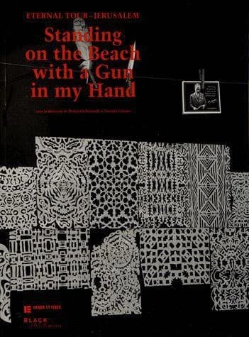 Standing on a beach with a gun in your hand