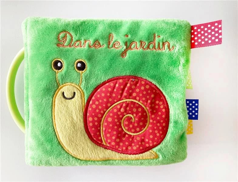 Dans le jardin : un premier imagier des animaux du jardin : un livre-tissu avec des flaps et des éléments sonores